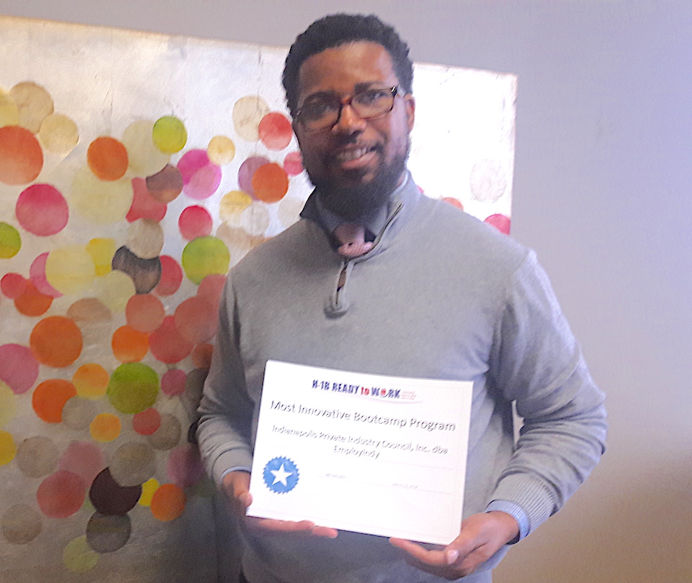 Employ Up Manager Brian Lawrence with Award